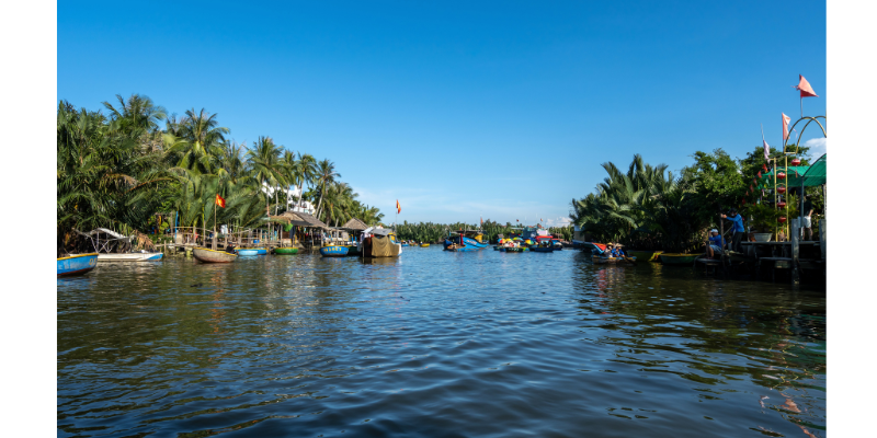 Tourists enjoying a basket boat ride through lush coconut forests in Hoi An - Hoi An 3 Day Itinerary Tourists enjoying a basket boat ride through lush coconut forests in Hoi An - Hoi An 3 Day Itinerary